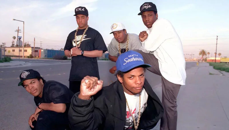 N.W.A, hip-hop’s street reporters, on March 23, 1989: Ice Cube, far left; Eazy-E, center; standing from left, DJ Yella, Dr. Dre and MC Ren. (Douglas R. Burrows / Los Angeles Times )